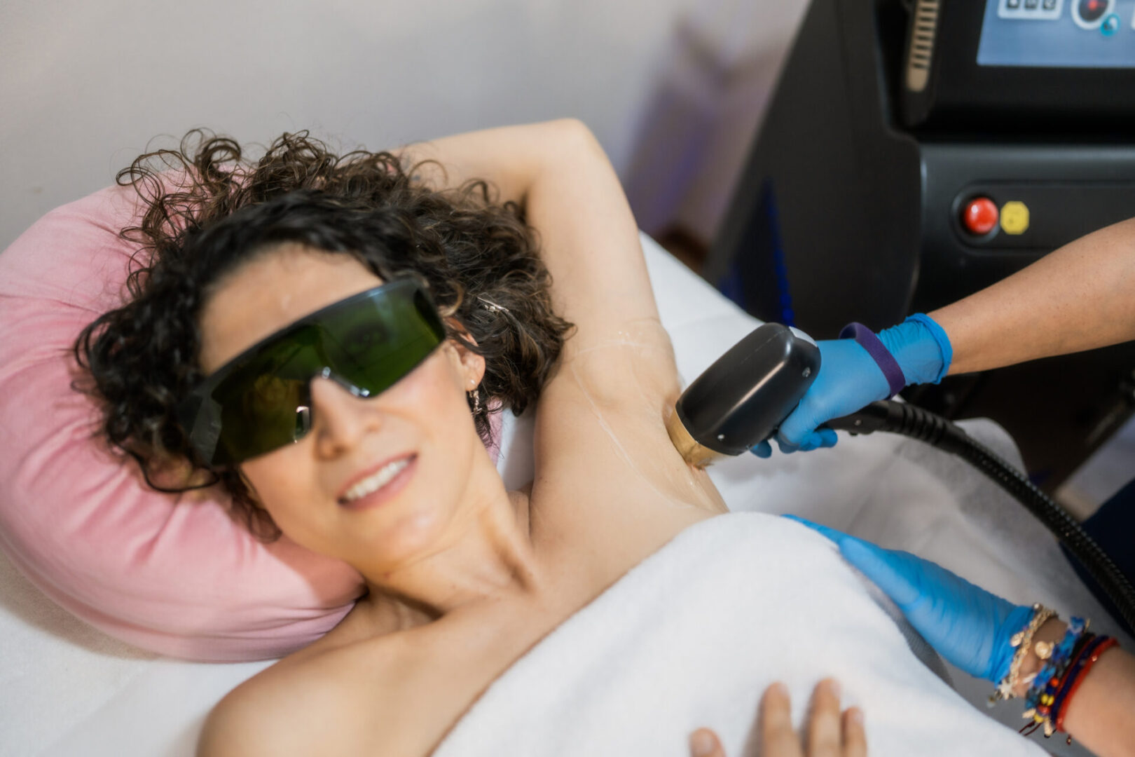 Woman receiving laser hair removal treatment